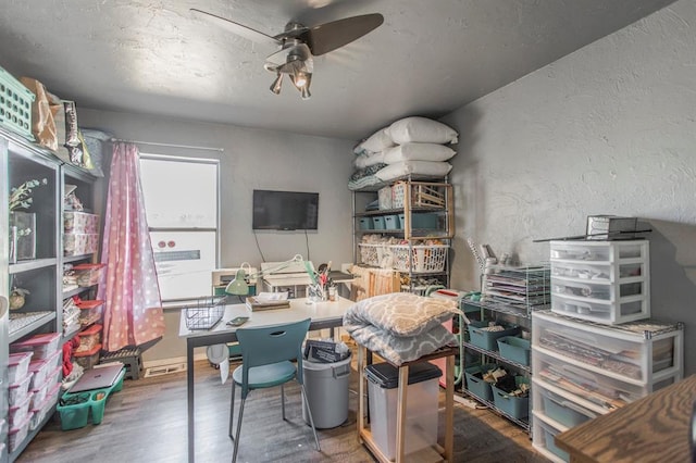1505 N Piedmont Rd, Yukon, OK 73099 - office space with a ceiling fan, wood finished floors, and a textured wall