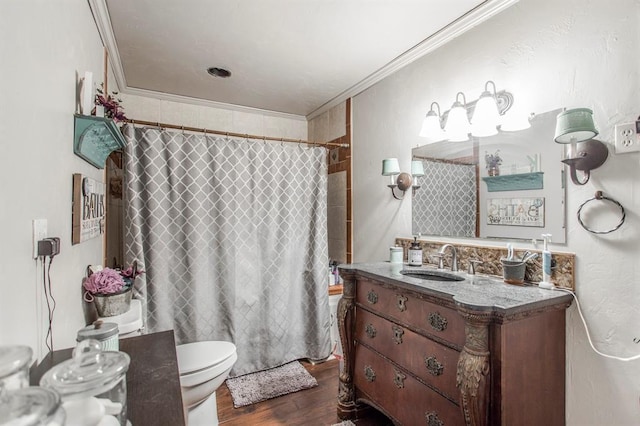 1505 N Piedmont Rd, Yukon, OK 73099 - full bath featuring toilet, wood finished floors, vanity, and ornamental molding