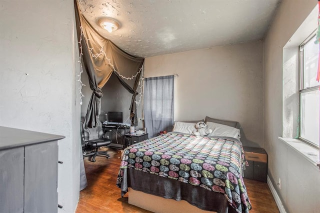 1505 N Piedmont Rd, Yukon, OK 73099 - bedroom with wood finished floors