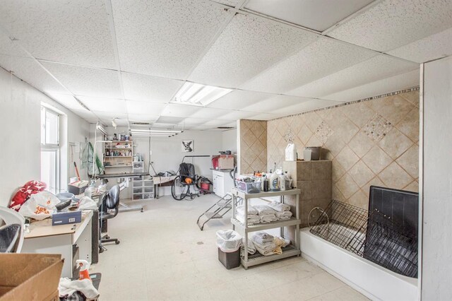 1505 N Piedmont Rd, Yukon, OK 73099 - basement featuring a paneled ceiling and tile patterned floors
