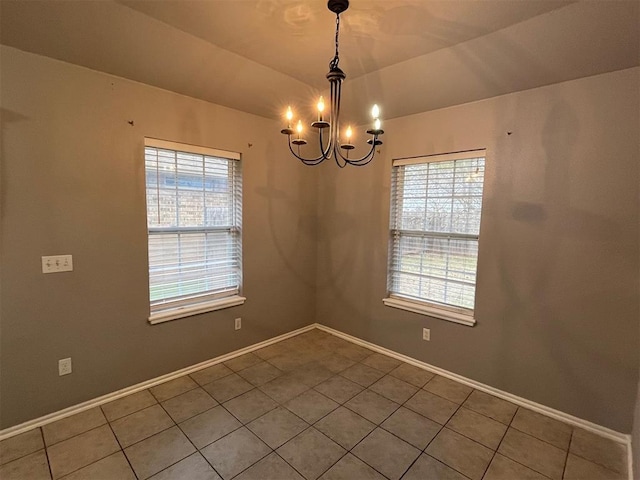 414 SE 7th St, Lexington, OK 73051 - tiled spare room featuring a chandelier and baseboards