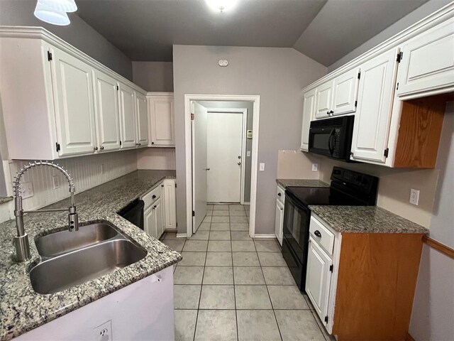 414 SE 7th St, Lexington, OK 73051 - kitchen featuring black appliances, a sink, white cabinets, light tile patterned floors, and lofted ceiling