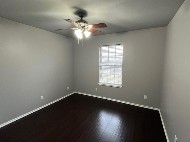 414 SE 7th St, Lexington, OK 73051 - spare room with a ceiling fan, baseboards, and dark wood-style floors