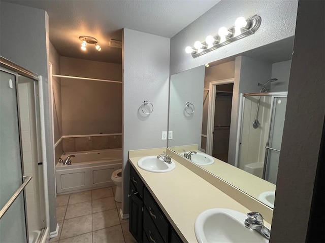 414 SE 7th St, Lexington, OK 73051 - bathroom with tile patterned floors, a stall shower, a garden tub, toilet, and a textured ceiling