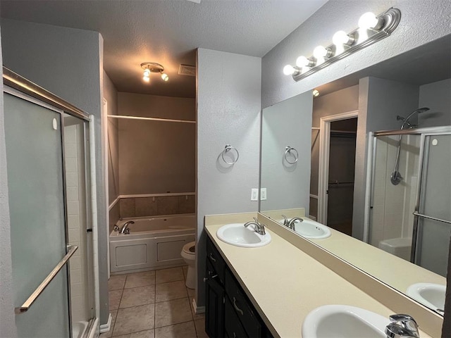 414 SE 7th St, Lexington, OK 73051 - bathroom with a shower stall, tile patterned flooring, a garden tub, double vanity, and toilet