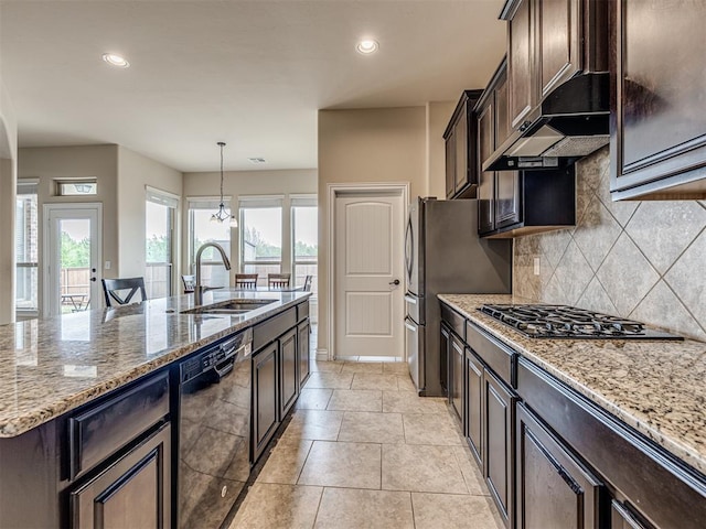 2500 Cordgrass Ln, Edmond, OK 73013 - kitchen with black dishwasher, gas stovetop, a sink, plenty of natural light, and recessed lighting
