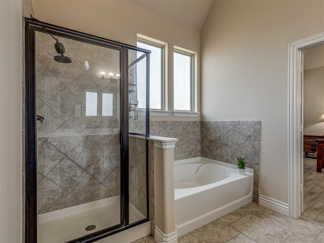 2500 Cordgrass Ln, Edmond, OK 73013 - full bath with a garden tub, a stall shower, lofted ceiling, and baseboards