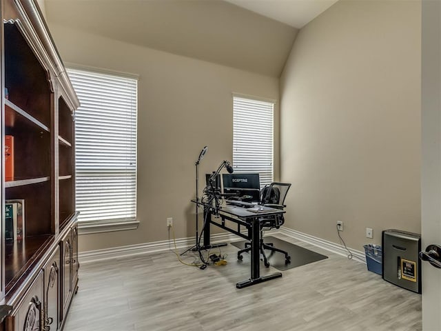 2500 Cordgrass Ln, Edmond, OK 73013 - home office featuring baseboards, light wood-type flooring, and vaulted ceiling