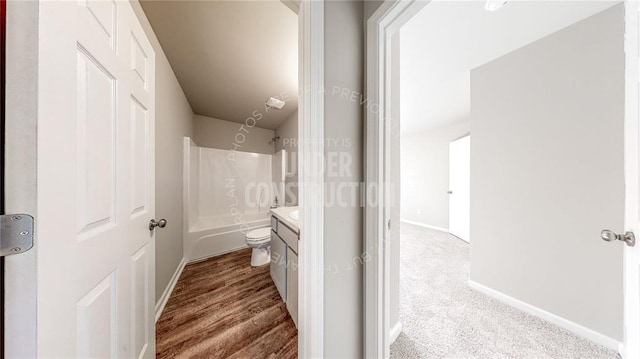 11817 NW 97th St, Yukon, OK 73099 - bathroom featuring vanity, baseboards, bathing tub / shower combination, and toilet