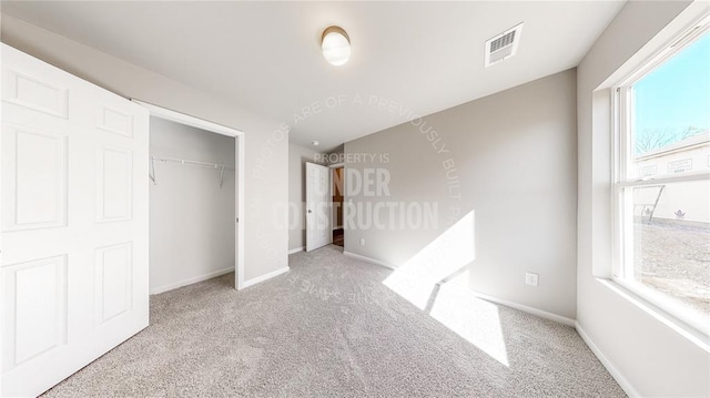 11817 NW 97th St, Yukon, OK 73099 - unfurnished bedroom featuring carpet, a closet, and baseboards