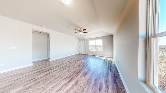 11817 NW 97th St, Yukon, OK 73099 - unfurnished room featuring ceiling fan, wood finished floors, baseboards, and vaulted ceiling