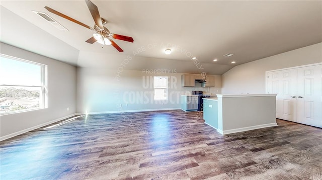 11817 NW 97th St, Yukon, OK 73099 - unfurnished living room with vaulted ceiling, dark wood-style flooring, ceiling fan, baseboards, and recessed lighting