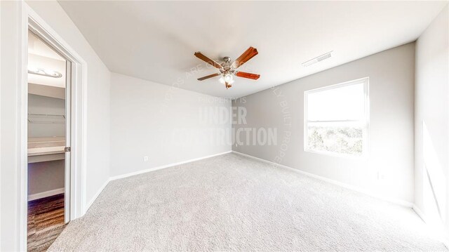 11817 NW 97th St, Yukon, OK 73099 - spare room featuring ceiling fan, carpet, and baseboards