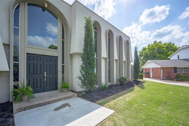 11000 Magnolia Park, Oklahoma City, OK 73120 - view of home's exterior with a lawn and stucco siding