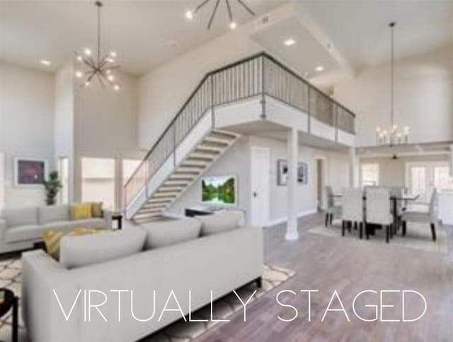 11000 Magnolia Park, Oklahoma City, OK 73120 - living room featuring a chandelier, a towering ceiling, stairs, wood finished floors, and recessed lighting