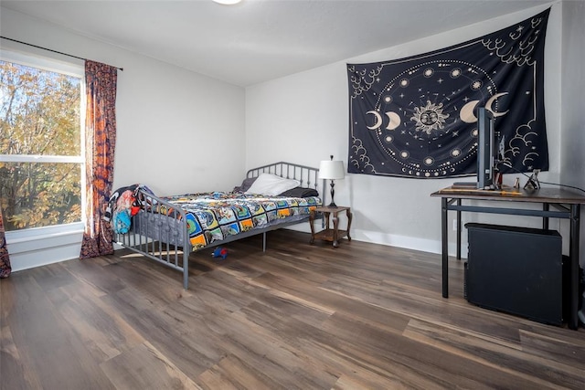 11000 Magnolia Park, Oklahoma City, OK 73120 - bedroom featuring wood finished floors and baseboards