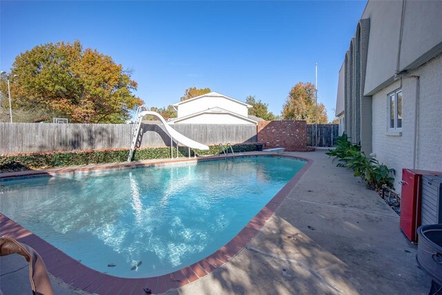11000 Magnolia Park, Oklahoma City, OK 73120 - view of swimming pool with a water slide and a fenced backyard