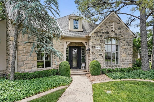 15005 Dourdan Ct, Oklahoma City, OK 73142 - view of front facade featuring stone siding and roof with shingles