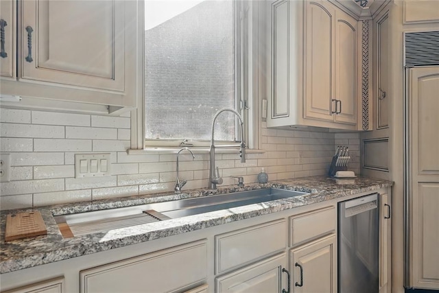 15005 Dourdan Ct, Oklahoma City, OK 73142 - kitchen with dishwasher, tasteful backsplash, and light stone countertops