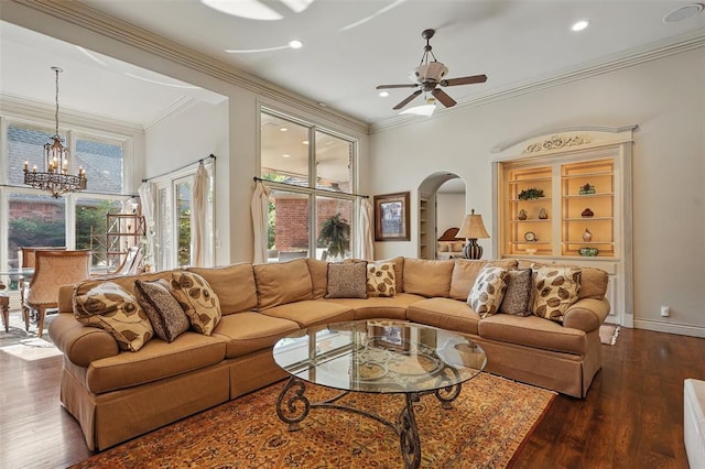 15005 Dourdan Ct, Oklahoma City, OK 73142 - living area with a chandelier, arched walkways, ornamental molding, a ceiling fan, and dark wood-style floors