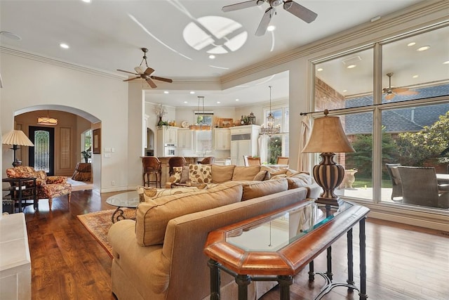 15005 Dourdan Ct, Oklahoma City, OK 73142 - living area with ceiling fan, arched walkways, wood finished floors, ornamental molding, and recessed lighting