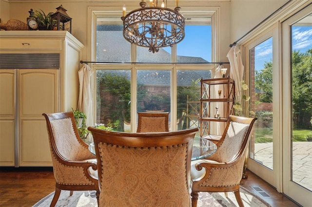 15005 Dourdan Ct, Oklahoma City, OK 73142 - dining room featuring a chandelier and dark wood finished floors