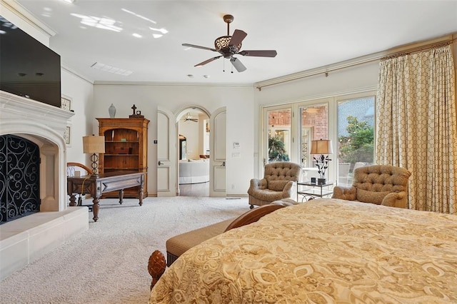 15005 Dourdan Ct, Oklahoma City, OK 73142 - carpeted bedroom with access to exterior, arched walkways, ornamental molding, and ceiling fan