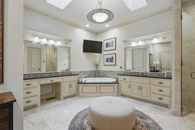 15005 Dourdan Ct, Oklahoma City, OK 73142 - bathroom with a skylight, a stall shower, two vanities, a garden tub, and recessed lighting