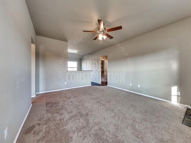 3909 S Ravine St, Stillwater, OK 74074 - spare room featuring a ceiling fan, baseboards, and carpet
