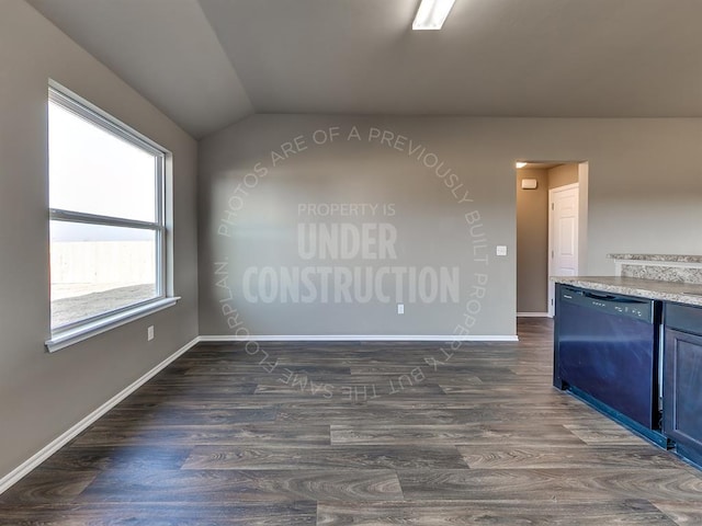 3909 S Ravine St, Stillwater, OK 74074 - unfurnished room with dark wood-style flooring, vaulted ceiling, and baseboards