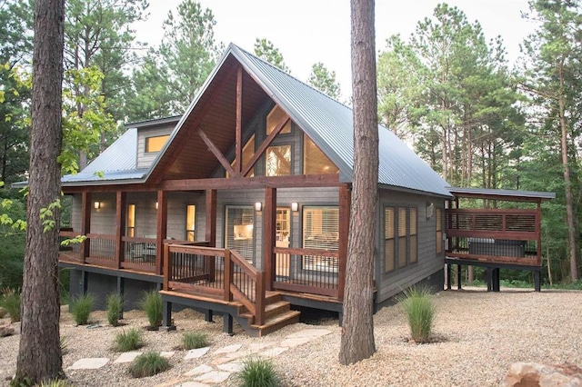 192 Grape Trl, Broken Bow, OK 74728 - view of front facade with a porch and metal roof