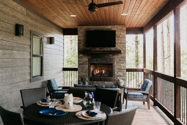192 Grape Trl, Broken Bow, OK 74728 - sunroom / solarium with ceiling fan, an outdoor living space with a fireplace, and healthy amount of natural light