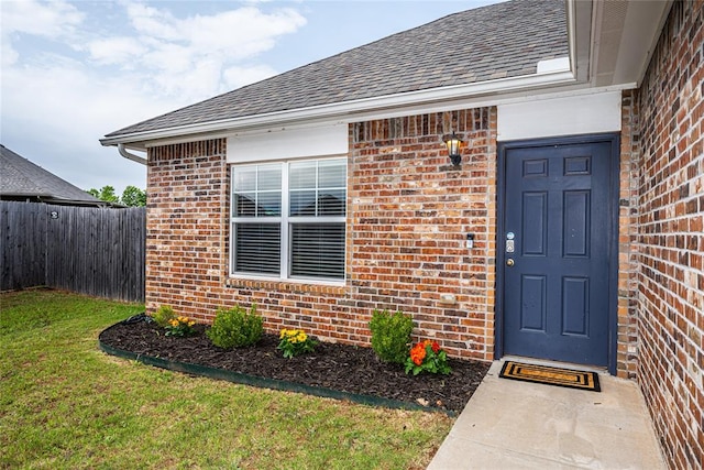 14201 Athens Ln, Yukon, OK 73099 - entrance to property featuring brick siding and roof with shingles