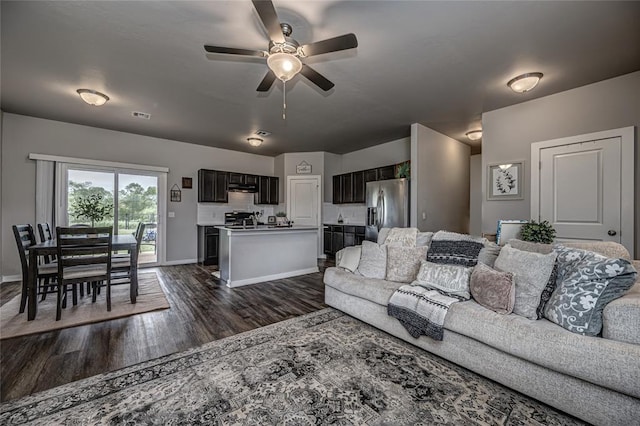 14201 Athens Ln, Yukon, OK 73099 - living room with ceiling fan, dark wood-style flooring, and baseboards