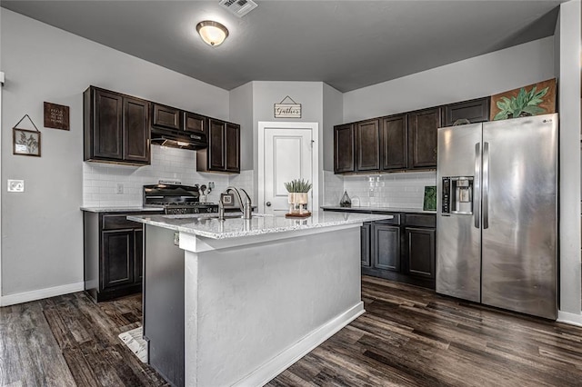 14201 Athens Ln, Yukon, OK 73099 - kitchen with stainless steel fridge, under cabinet range hood, range, and decorative backsplash