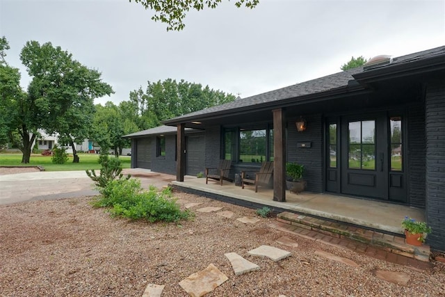 300 E Federal St, Shawnee, OK 74804 - entrance to property featuring covered porch and brick siding
