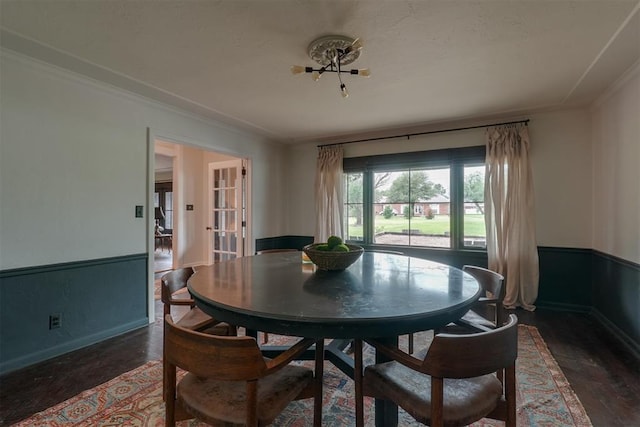 300 E Federal St, Shawnee, OK 74804 - dining area with ornamental molding, baseboards, wood finished floors, and wainscoting