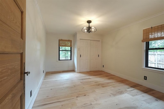 300 E Federal St, Shawnee, OK 74804 - entryway featuring ornamental molding, a chandelier, light wood finished floors, and baseboards