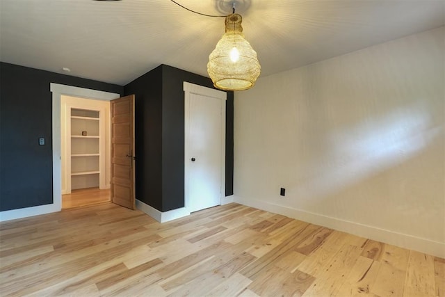 300 E Federal St, Shawnee, OK 74804 - spare room with light wood-type flooring and baseboards