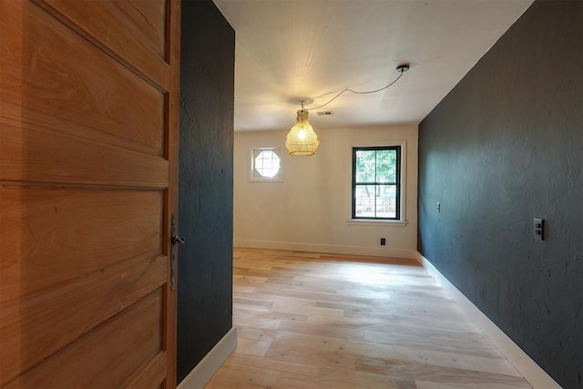 300 E Federal St, Shawnee, OK 74804 - unfurnished dining area featuring light wood-type flooring and baseboards