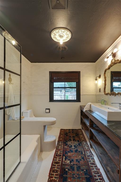 300 E Federal St, Shawnee, OK 74804 - bathroom featuring double vanity, tile patterned flooring, and toilet