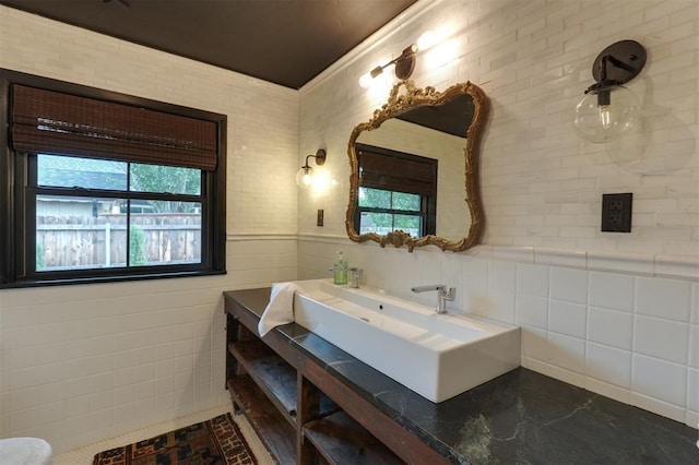 300 E Federal St, Shawnee, OK 74804 - bathroom featuring healthy amount of natural light, vanity, and wainscoting