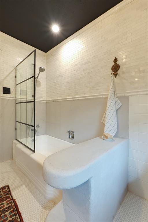 300 E Federal St, Shawnee, OK 74804 - full bathroom with bathing tub / shower combination, tile patterned floors, and tile walls