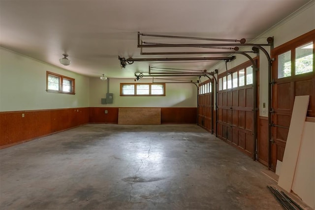 300 E Federal St, Shawnee, OK 74804 - garage with a wainscoted wall, wood walls, and electric panel