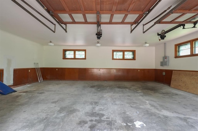 300 E Federal St, Shawnee, OK 74804 - garage with electric panel, a wainscoted wall, and wood walls