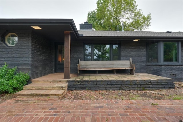 300 E Federal St, Shawnee, OK 74804 - view of exterior entry featuring a chimney