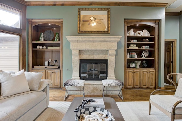 1918 Winding Ridge Rd, Edmond, OK 73034 - living room with ornamental molding, a fireplace, wood finished floors, and a ceiling fan