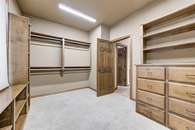 1918 Winding Ridge Rd, Edmond, OK 73034 - walk in closet featuring light colored carpet