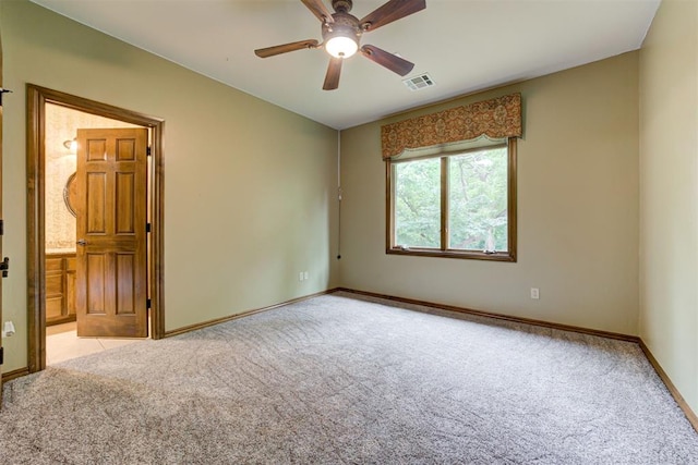 1918 Winding Ridge Rd, Edmond, OK 73034 - empty room featuring light carpet and a ceiling fan