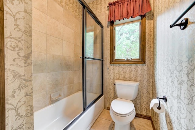 1918 Winding Ridge Rd, Edmond, OK 73034 - full bath featuring wallpapered walls, bath / shower combo with glass door, and tile patterned floors